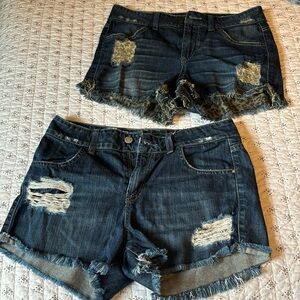 Guess cut off shorts. Size 27. Two pairs with hole details and cut off legs.